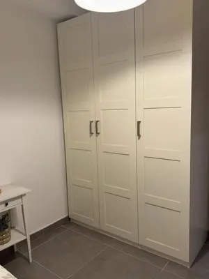 a white closet with white doors in a room at UIM Mediterraneo Hispanidad 4 Wifi in Puerto de Sagunto