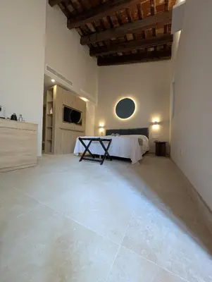 a coffee machine sitting on top of a wooden table at Hotel San Lorenzo Boutique Catedral in Valencia