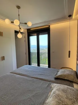 a bedroom with a bed and a large window at Casa with View in Alginet
