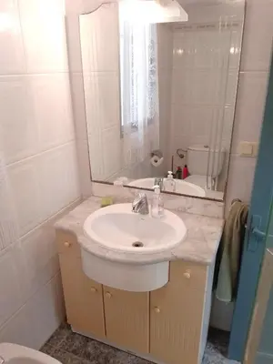 a bathroom with a sink and a mirror at Pasaje Alzira 4B, 1-3 in Cullera