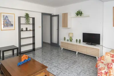 a living room with a tv and a couch at Pasaje Alzira 4B, 1-3 in Cullera