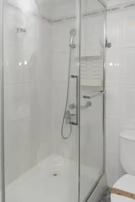 a shower with a glass door in a bathroom at Pasaje Alzira 4B, 1-3 in Cullera