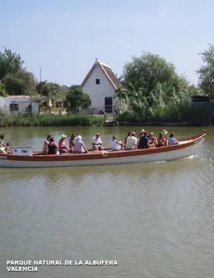 a group of people in a boat on the water at Apartamento Cabañal in Cullera