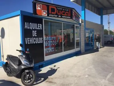 a motorcycle parked in front of a store at Apartamento Cabañal in Cullera
