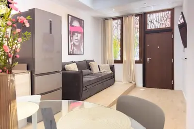 a living room with a couch and a table at SingularStays Olimpia in Valencia