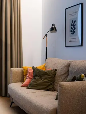 a couch with pillows on it in a living room at Dos Corazones in Valencia