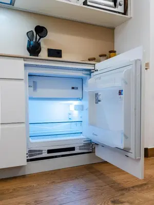 a refrigerator with its door open in a kitchen at Dos Corazones in Valencia