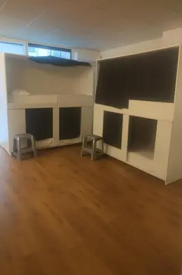 an empty room with two bunk beds and two stools at Cozy Nook in Valencia