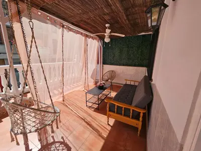 an overhead view of a porch with a swing at La Maison du Port in Puerto de Sagunto