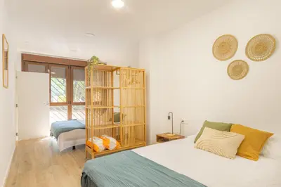 a bedroom with a bed and a book shelf at VL - Carrer de Berni i Catala in Valencia