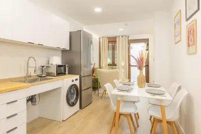 a kitchen and dining room with a table and chairs at VL - Carrer de Berni i Catala in Valencia