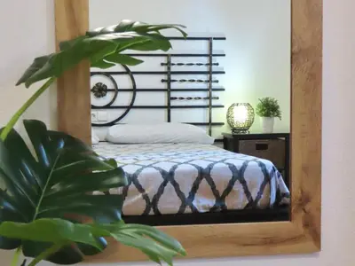 a bedroom with a bed and a mirror at Casa Playamonte in Navarrés