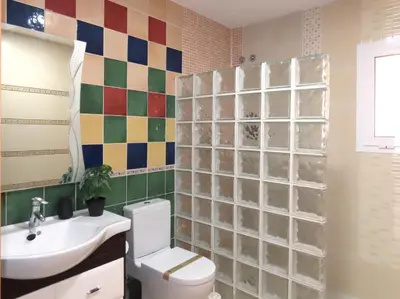a bathroom with a toilet and a sink at Casa del Prado in Navarrés