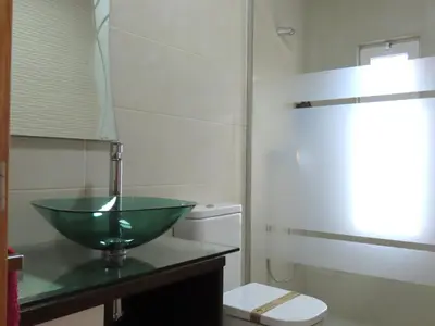 a bathroom with a green sink and a toilet at Casa del Prado in Navarrés