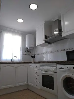 a kitchen with white cabinets and a dishwasher at Apartamento en Canet Berenguer Valencia in Canet de Berenguer