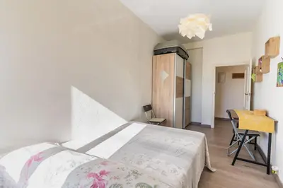 a bedroom with a bed and a table and a desk at Invalencia - Begis Flat Cabanyal in Valencia