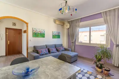 a living room with a couch and a table at Invalencia - Begis Flat Cabanyal in Valencia