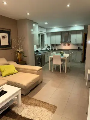 a living room with a couch and a table at Oceanfront Ideal for couples and teleworking in Moncófar