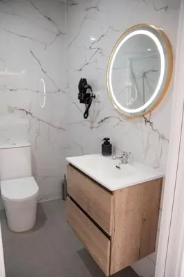 a bathroom with a sink and a mirror at M&A Hostal en Onda in Bechí