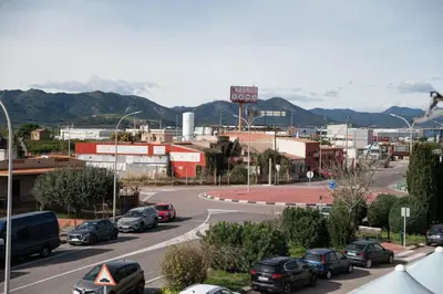 a city street with cars parked on the road at M&A Hostal en Onda in Bechí