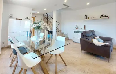 a living room with a glass table and a couch at Awesome Home In Turis in Turís