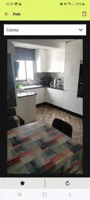 a picture of a kitchen with a rug on the floor at FC house in Valencia