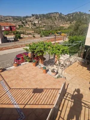 a shadow of a person standing on a patio at Quesa Tranquil Valencia in Quesa