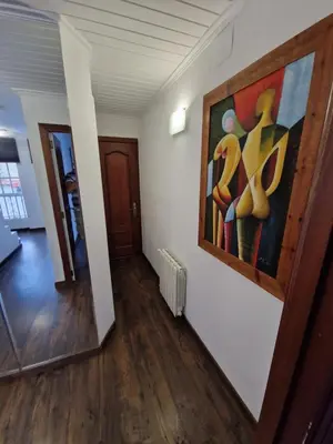 a room with a painting on the wall and a hallway at Quesa Tranquil Valencia in Quesa