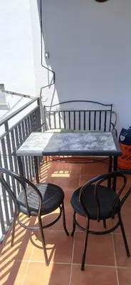 a table and two chairs sitting on a balcony at Casa Paola in Buñol