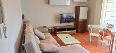 a living room with a couch and a television at Casa Paola in Buñol