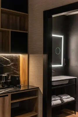 a bathroom with a sink and a counter with towels at Blanq Gran vía in Valencia