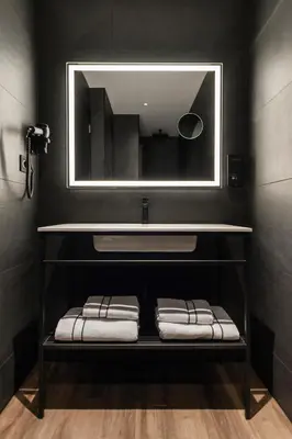 a bathroom with a sink and a mirror at Blanq Gran vía in Valencia