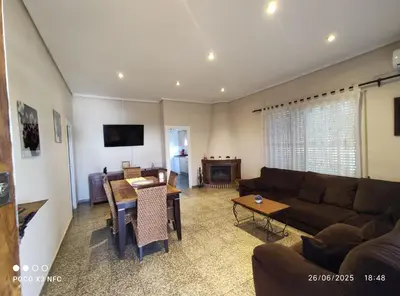 a living room with a couch and a table at Chalet en el parque natural de la Calderona in Náquera