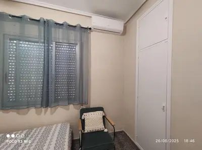 a bedroom with a bed and a window at Chalet en el parque natural de la Calderona in Náquera