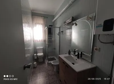 a bathroom with a sink and a toilet and a shower at Chalet en el parque natural de la Calderona in Náquera