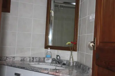 a bathroom with a sink and a mirror at Casa Rural 