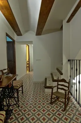 a room with a table and chairs and a table and a table at Casa Rural 
