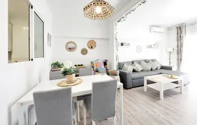 a living room with a table and a couch at Nice Apartment In Puebla De Farnals in Puebla de Farnals