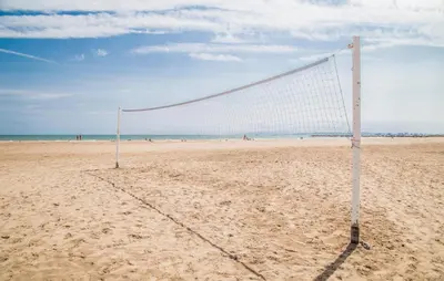 a volley ball net on a sandy beach at Nice Apartment In Puebla De Farnals in Puebla de Farnals