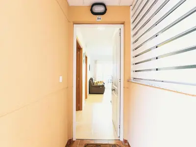 a hallway leading to a room with a hallway at Spectacular views of the sea and the lighthouse in Canet de Berenguer