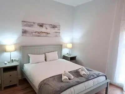 a bedroom with a bed with two towels on it at Amazing bright and recently remodeled apartment in Valencia