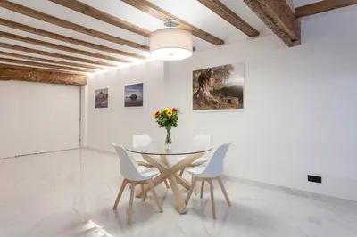 a dining room with a glass table and chairs at Valencia Flat Rental City center town hall in Valencia