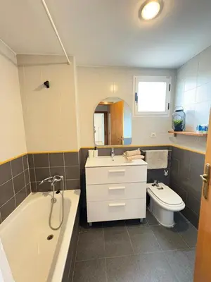 a bathroom with a tub and a sink and a toilet at UIM Mediterraneo Alpuente Wifi in Puerto de Sagunto