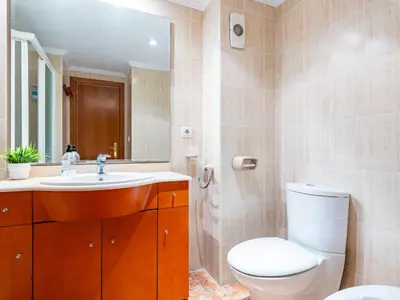 a bathroom with a toilet and a sink at Apartment Playa Patacona by Interhome in Valencia