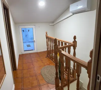 a staircase in a house with a door at Casa Alan in Burriana