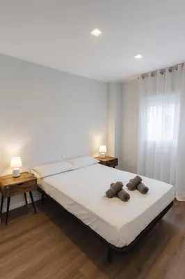 a bedroom with a bed with two pillows on it at Apartment Market Ruzafa 10B in Valencia