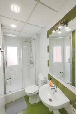 a bathroom with a white toilet and a sink at Apartment Market Ruzafa 10B in Valencia
