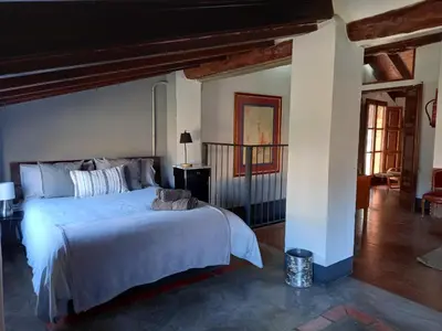 a bedroom with a large bed in a room at Casa Rural La Rocha in Chulilla
