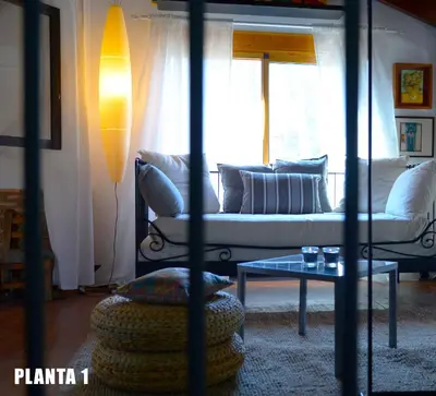 a living room with a couch and a table at Casa Rural La Rocha in Chulilla