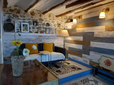 a living room with a couch and a table at Casa Rural La Rocha in Chulilla